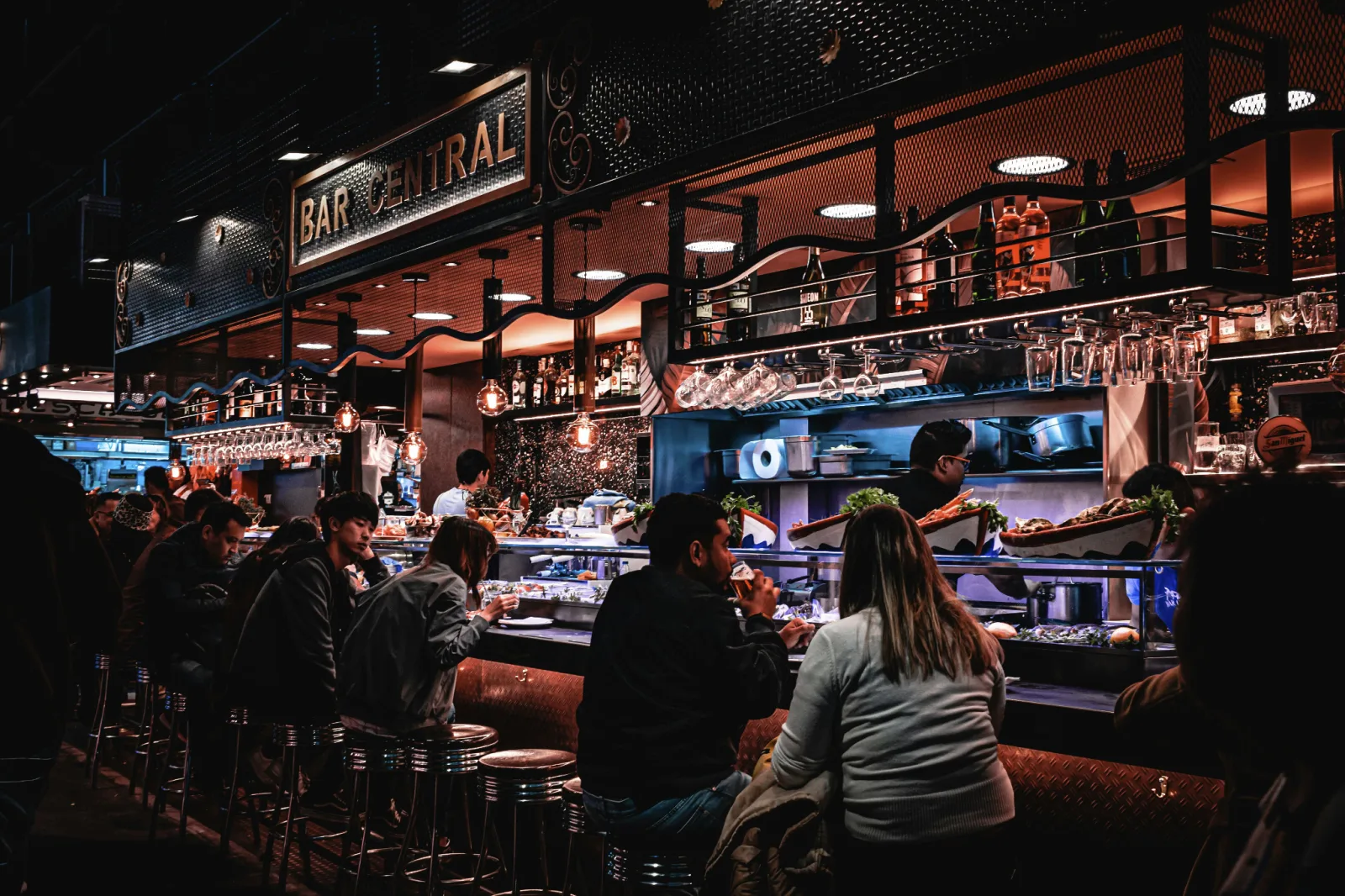 Lively bar with people eating and drinking