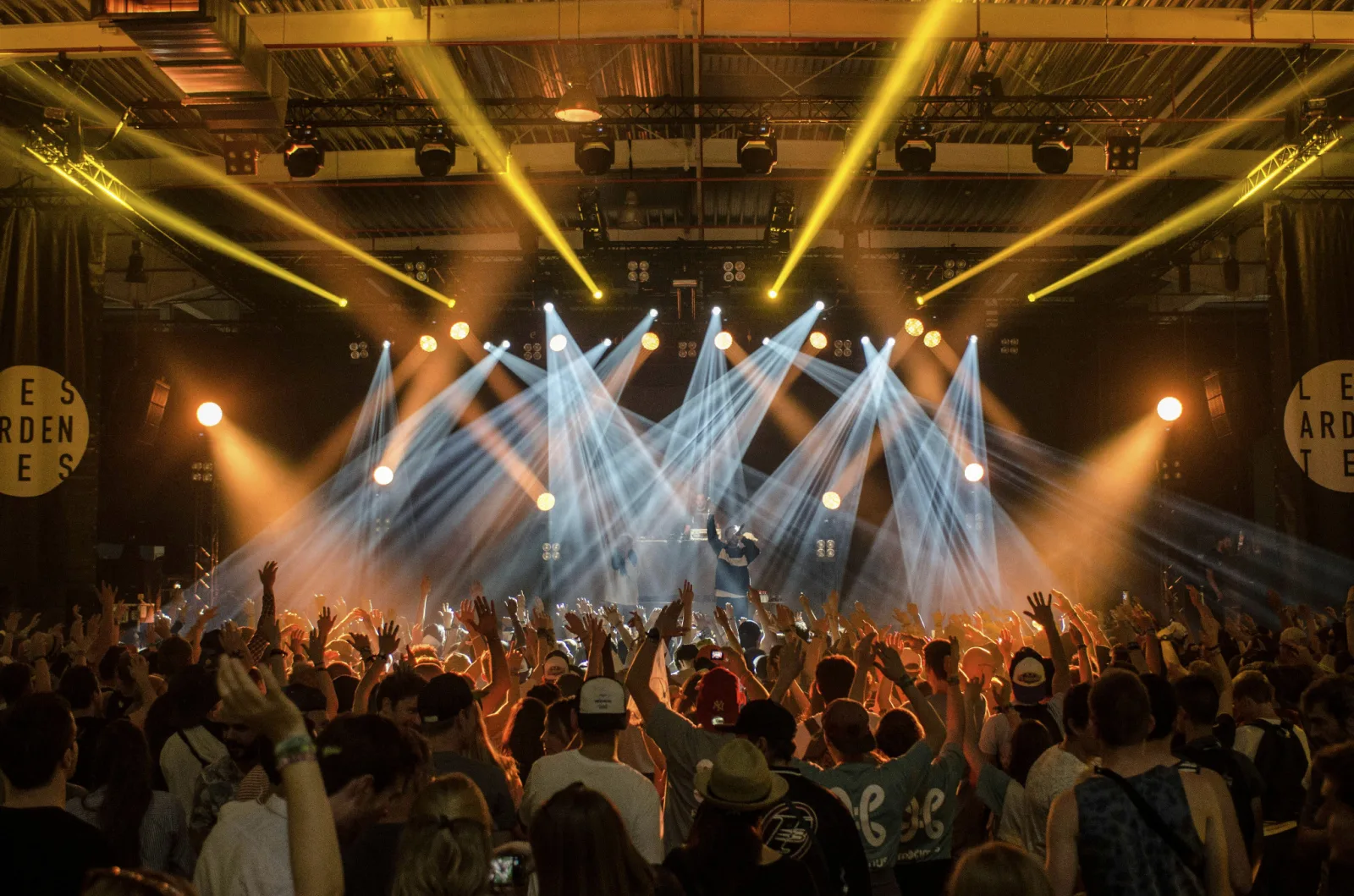 Crowd at a live concert under bright stage lights